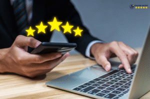 A happy business owner reading a positive online review that boosted customer trust and improved brand reputation.