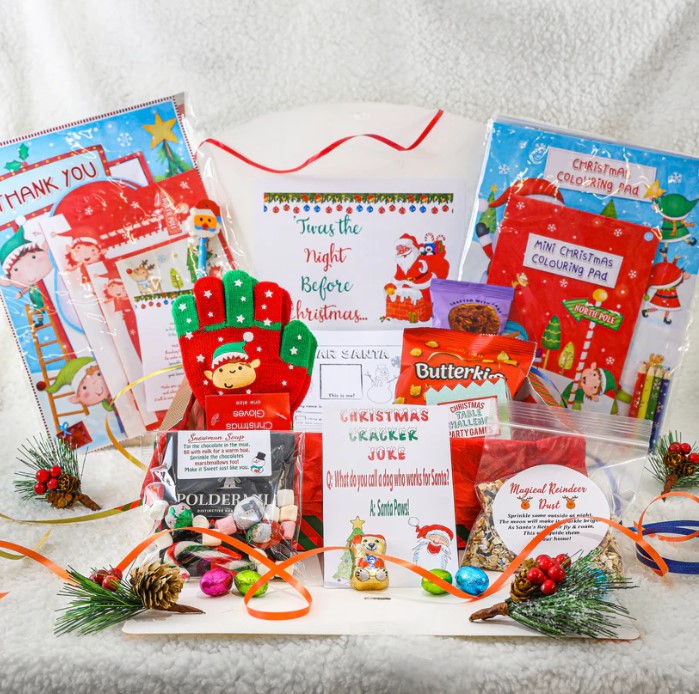 A beautifully curated Christmas Eve box with ideas for adults, babies, family, and teenagers